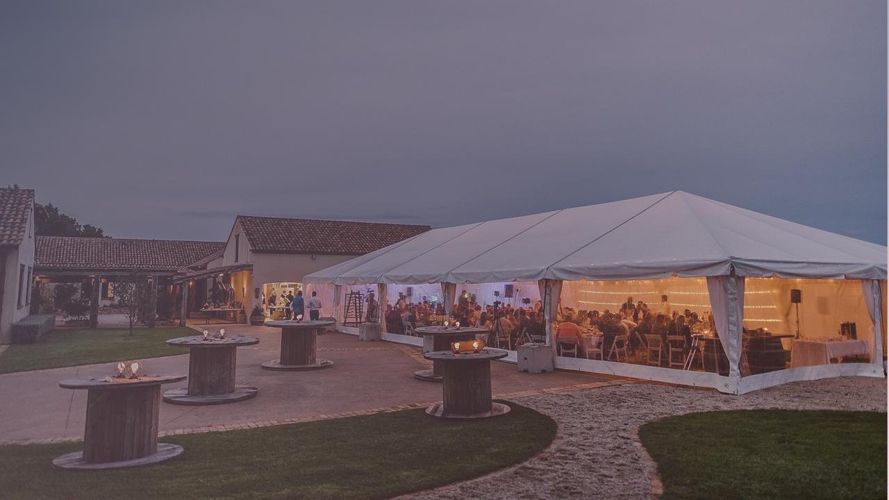 Silkliner wedding marquee illuminated for an outdoor evening reception